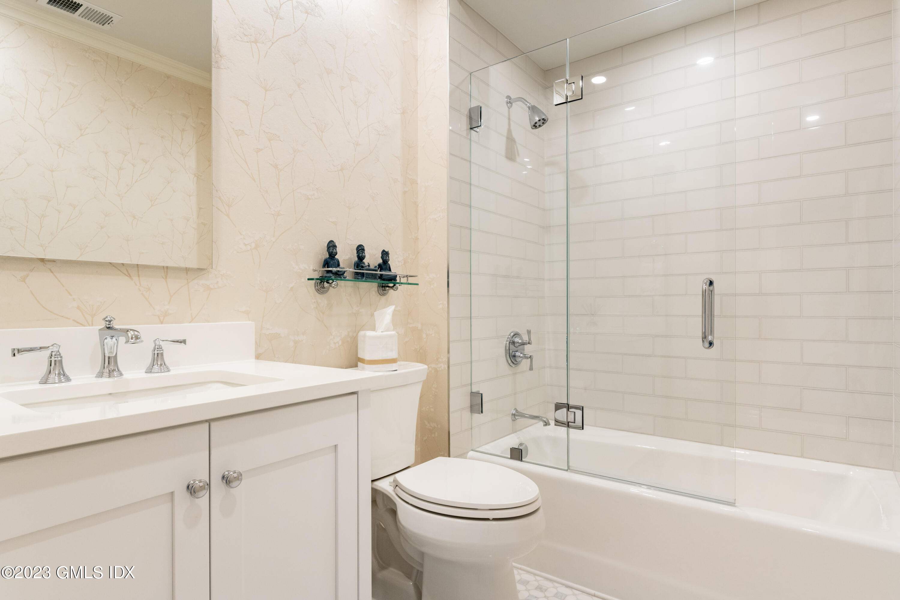 633 Steamboat Road, Unit 2 Greenwich, CT 06830 - Photo 23 of 27 a bathroom with a sink toilet vanity and shower