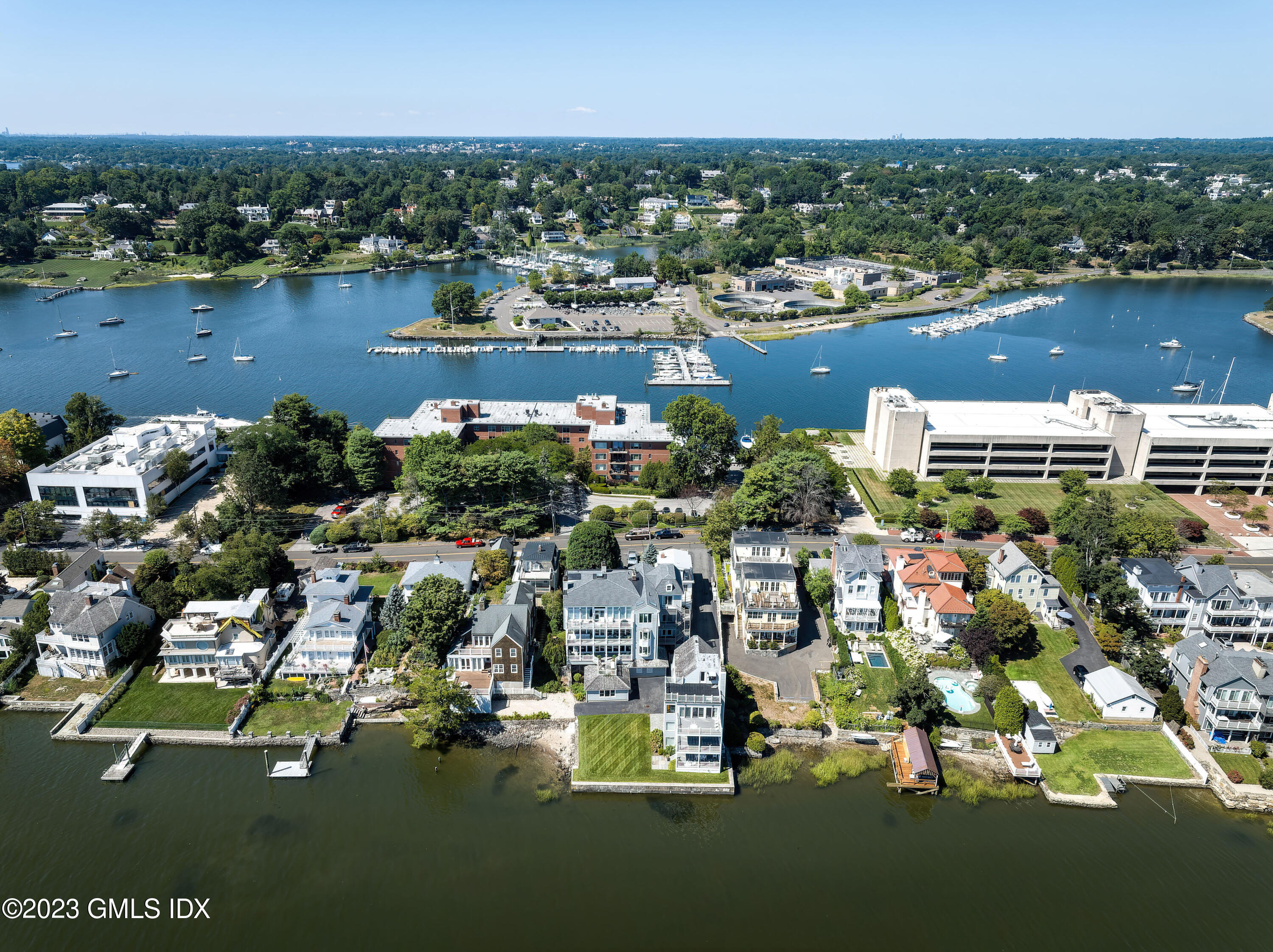 633 Steamboat Road, Unit 2 Greenwich, CT 06830 - Photo 3 of 27 an aerial view of residential houses with outdoor space and lake view