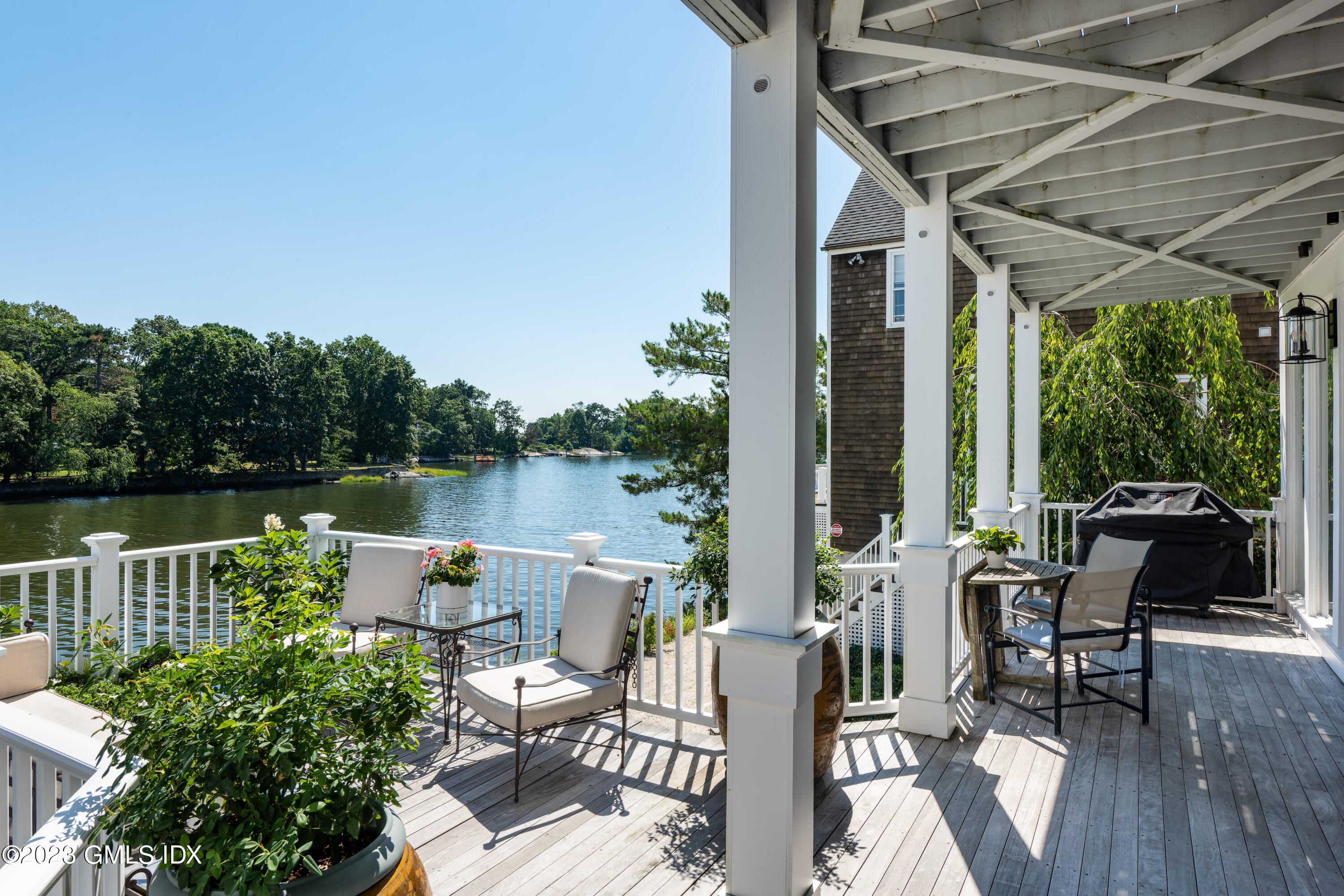 633 Steamboat Road, Unit 2 Greenwich, CT 06830 - Photo 9 of 27 a patio with water view fountain plants and lake view