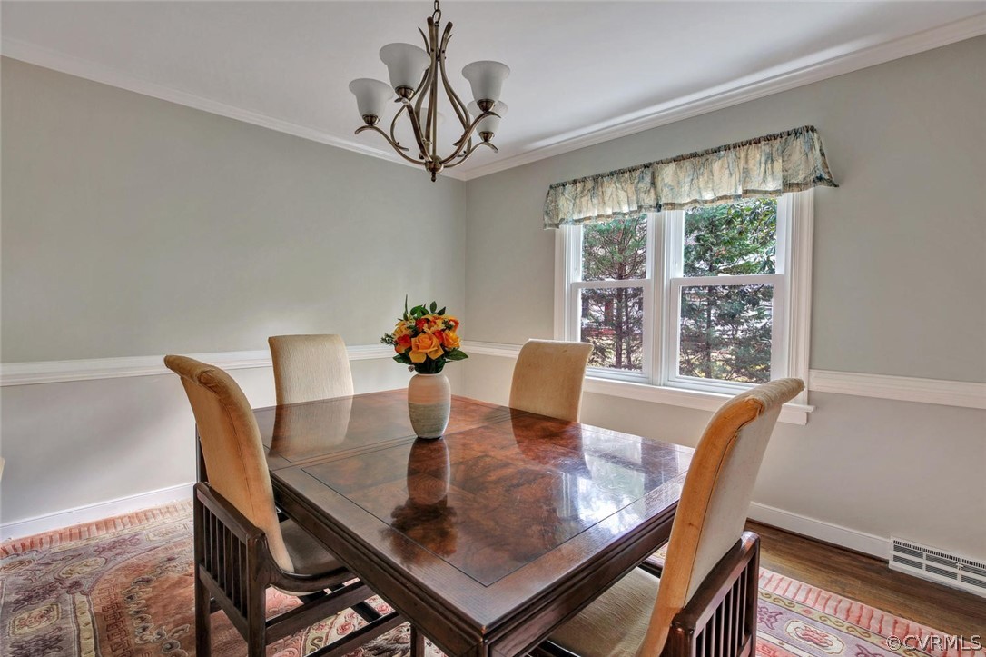 8714 Wishart Road Henrico, VA 23229 - Photo 7 of 35 Formal dining room with chair and crown molding an