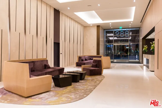 a living room with furniture and large window