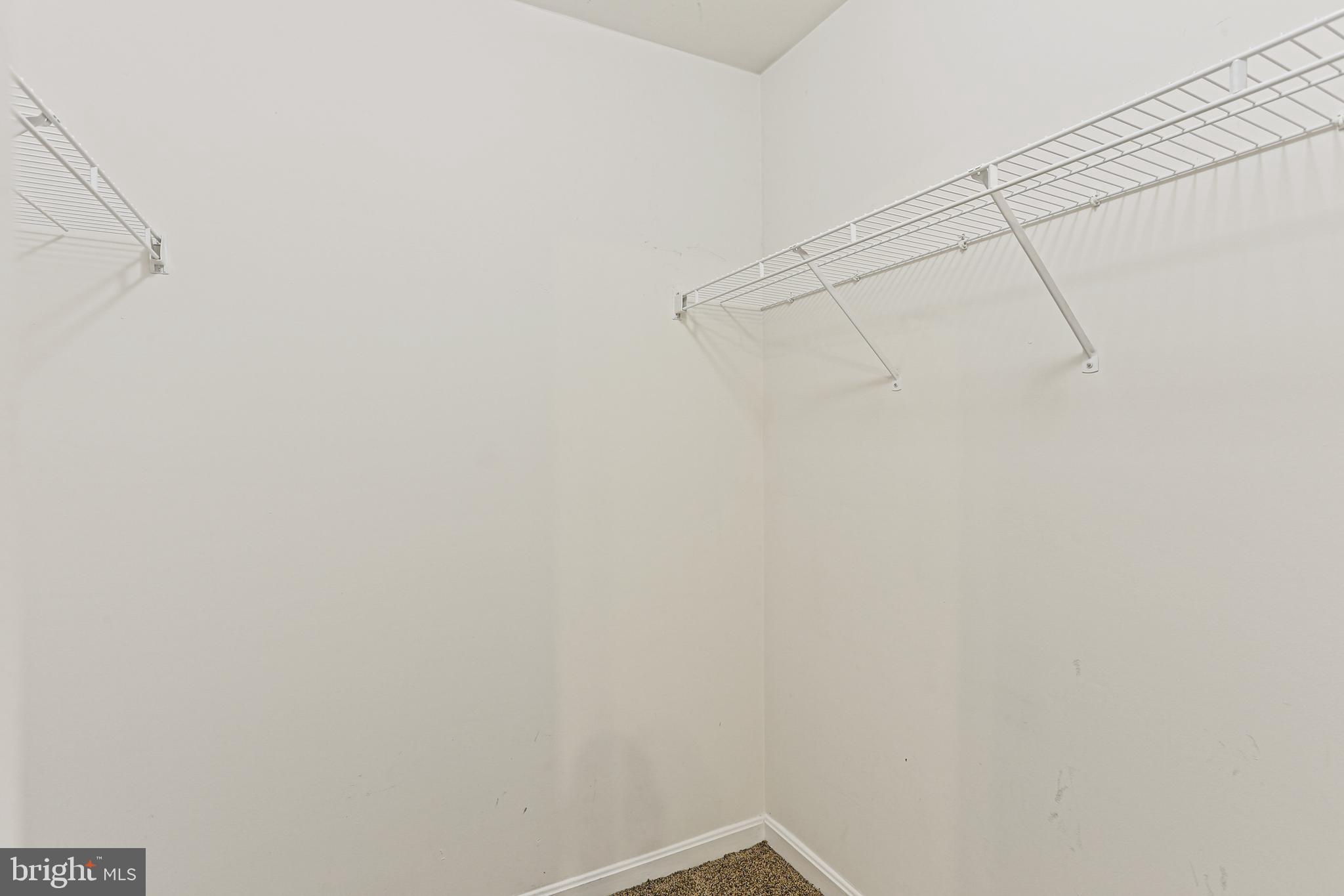 662 Howards Loop Annapolis, MD 21401 - Photo 18 of 29 a view of a room with racks on the wall