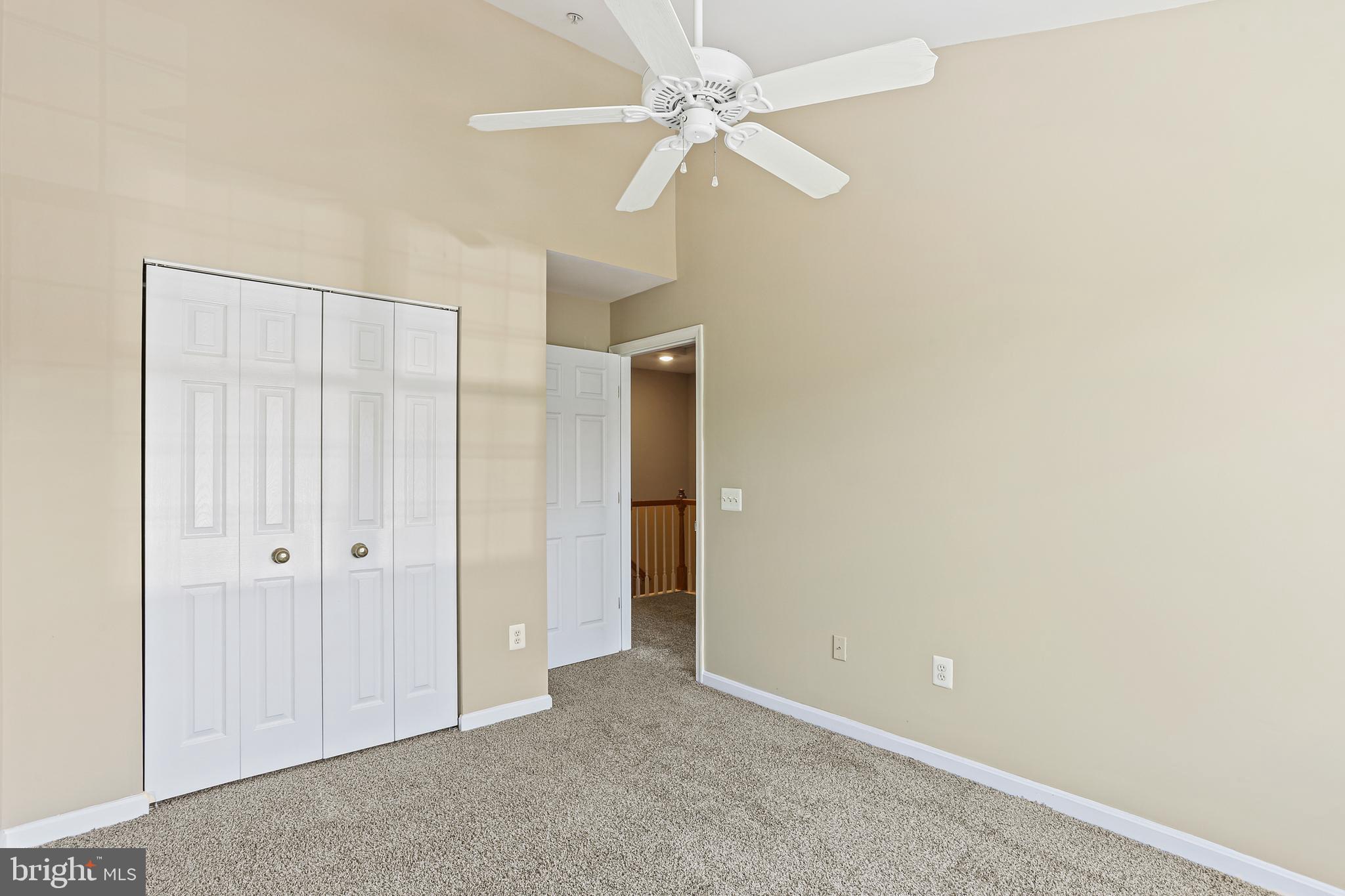 662 Howards Loop Annapolis, MD 21401 - Photo 19 of 29 an empty room with a ceiling fan and a window