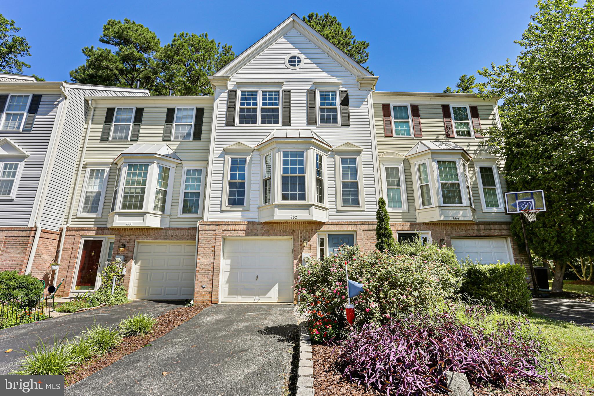 662 Howards Loop Annapolis, MD 21401 - Photo 29 of 29 a front view of a residential apartment building with a yard