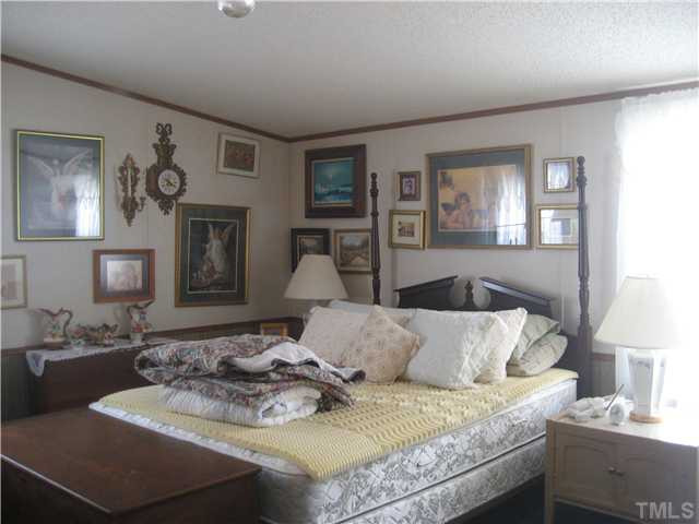 8 Weaver Road Kenly, NC 27542 - Photo 4 of 14 Master Bedroom with cathedral ceiling.