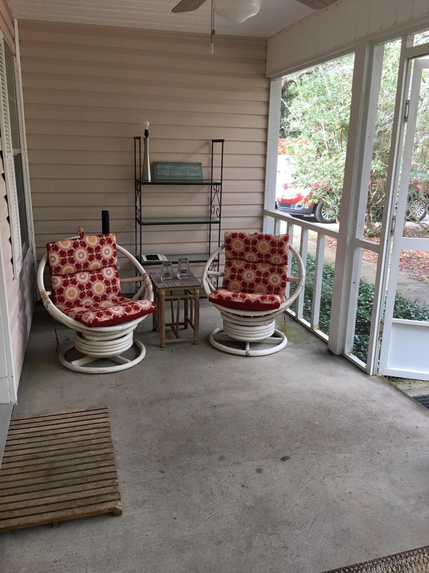 274 North Bishop Road Santa Rosa Beach, FL 32459 - Photo 13 of 17 a room with a mini refrigerator and outdoor seating