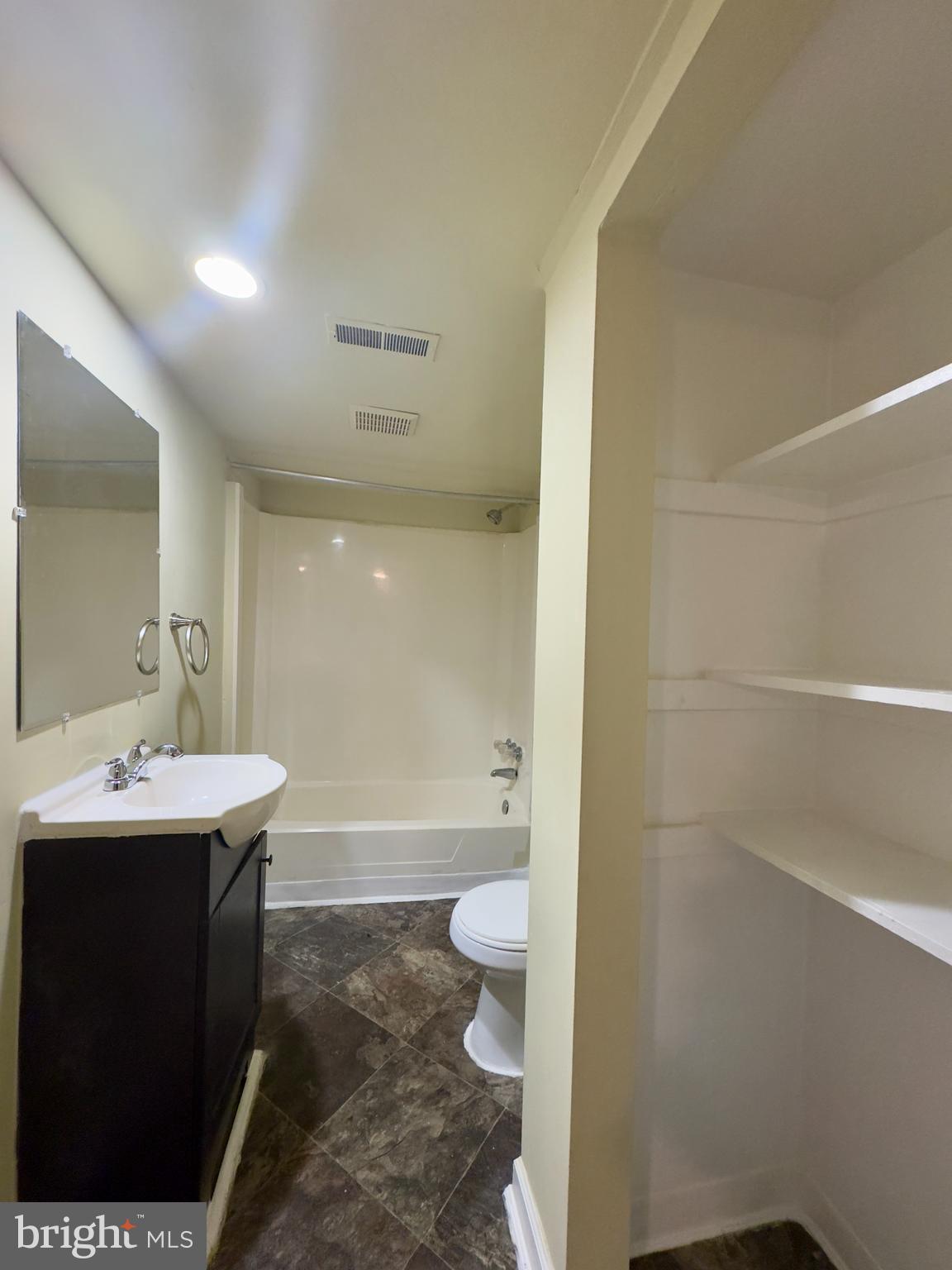 1503 Eutaw Place, Unit B1 Baltimore, MD 21217 - Photo 4 of 7 a bathroom with a sink a toilet and shower