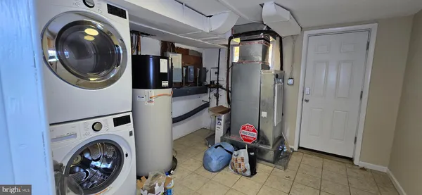 a view of a storage & utility room with washer and dryer