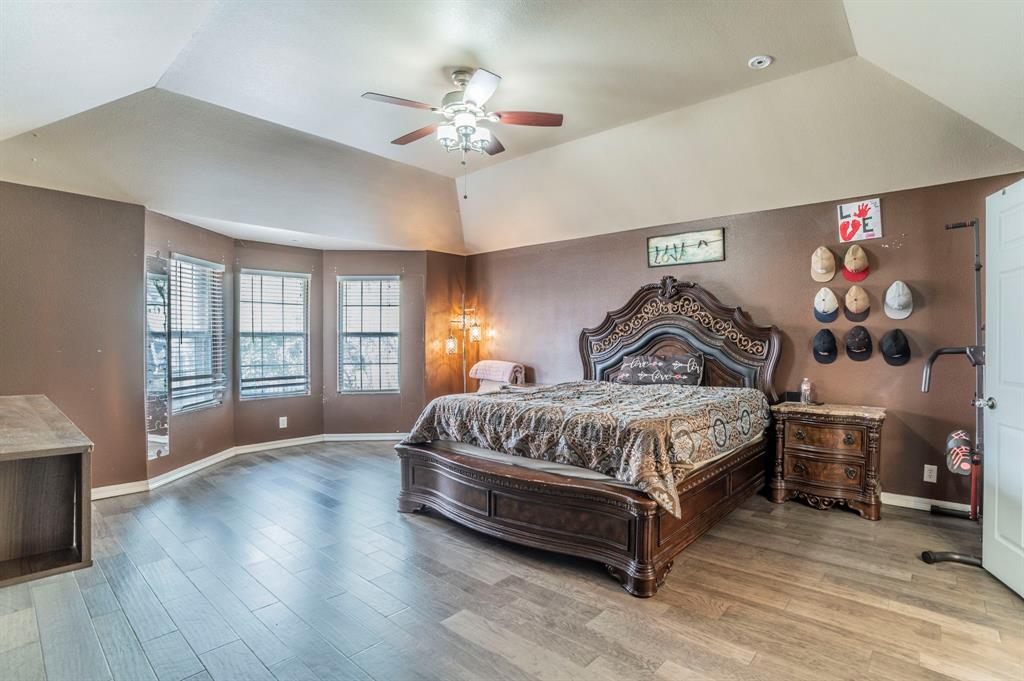 3934 Harlingen Street Dallas, TX 75212 - Photo 12 of 26 a spacious bedroom with a bed and window