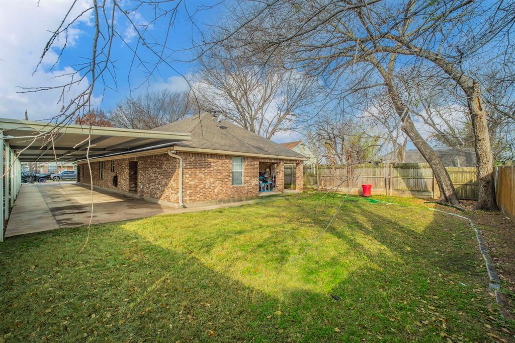 3934 Harlingen Street Dallas, TX 75212 - Photo 23 of 26 a view of a house with a yard