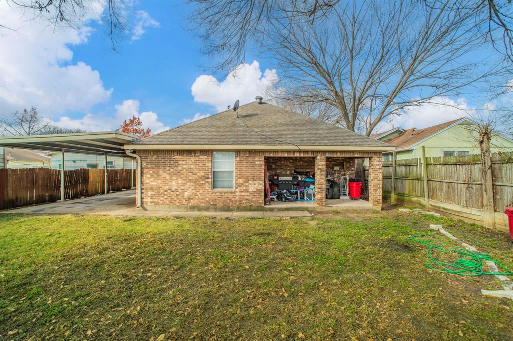 3934 Harlingen Street Dallas, TX 75212 - Photo 24 of 26 a view of a house with a yard and garage