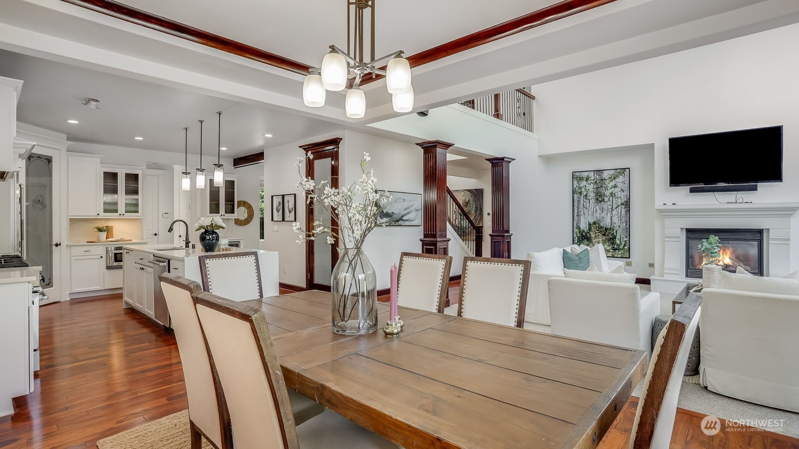 1152 Queen Avenue Northeast Renton, WA 98056 - Photo 14 of 40 a view of a dining room with furniture a chandelier and wooden floor