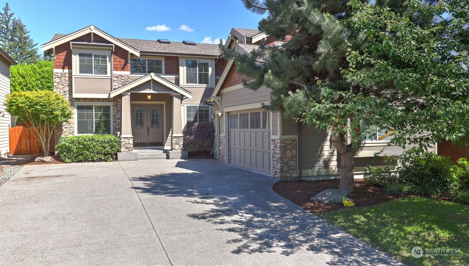 1152 Queen Avenue Northeast Renton, WA 98056 - Photo 2 of 40 a front view of a house with a yard
