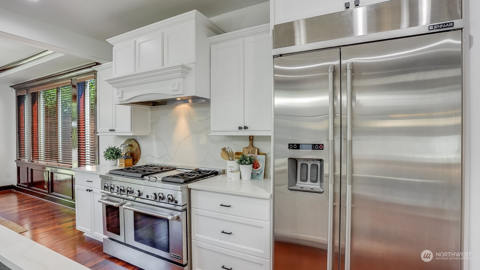 1152 Queen Avenue Northeast Renton, WA 98056 - Photo 21 of 40 a kitchen with stainless steel appliances granite countertop a stove and a refrigerator