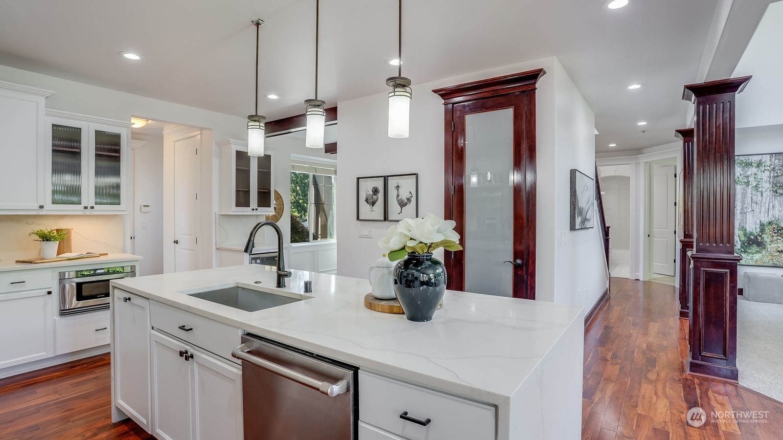 1152 Queen Avenue Northeast Renton, WA 98056 - Photo 22 of 40 a kitchen with a sink a counter space and stainless steel appliances