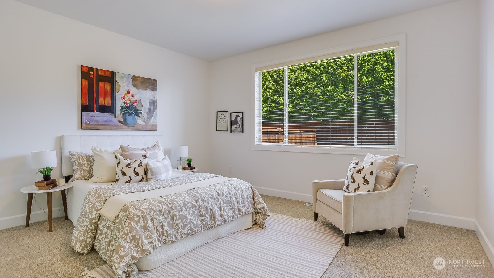 1152 Queen Avenue Northeast Renton, WA 98056 - Photo 28 of 40 a bedroom with a bed and wooden floor