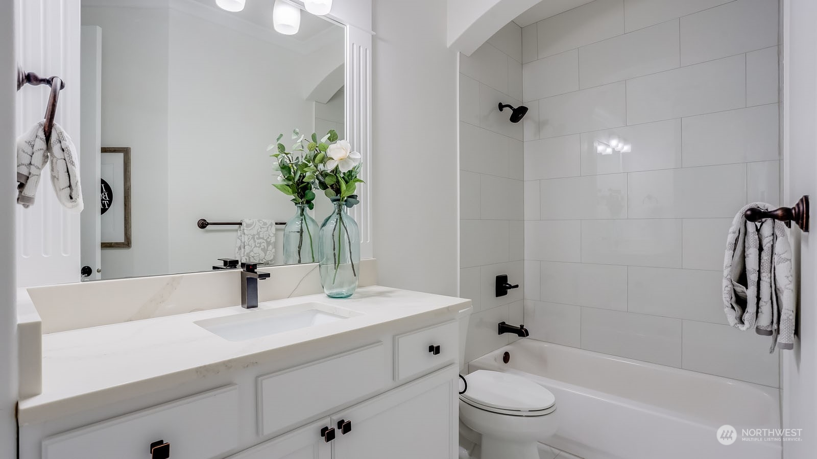 1152 Queen Avenue Northeast Renton, WA 98056 - Photo 30 of 40 a bathroom with a sink a toilet and shower