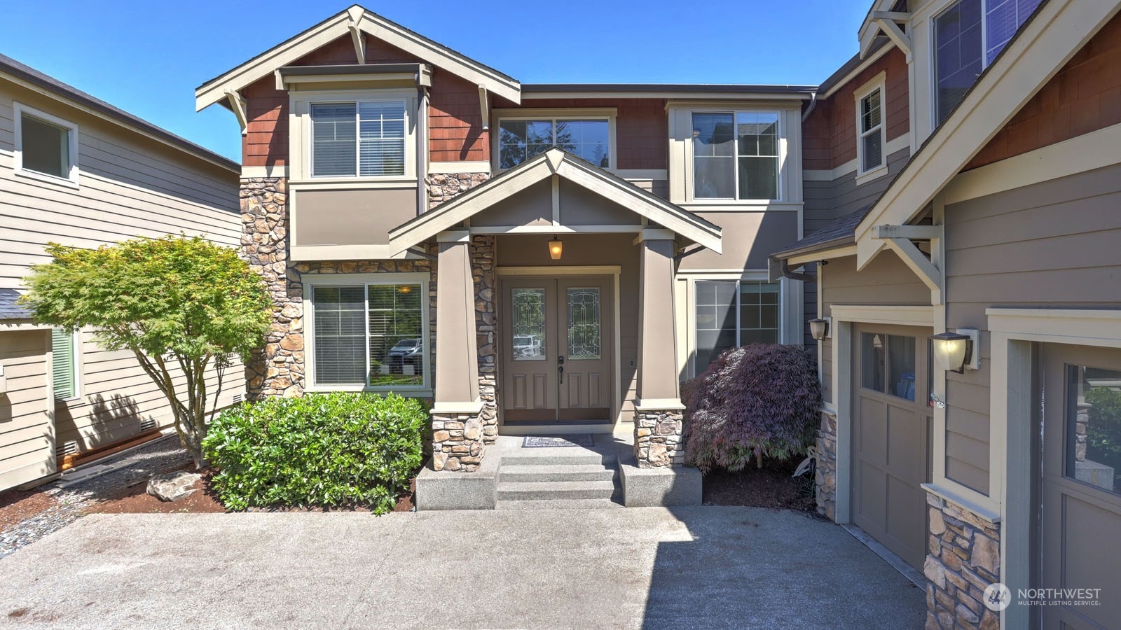 1152 Queen Avenue Northeast Renton, WA 98056 - Photo 3 of 40 a front view of a house with a yard and potted plants