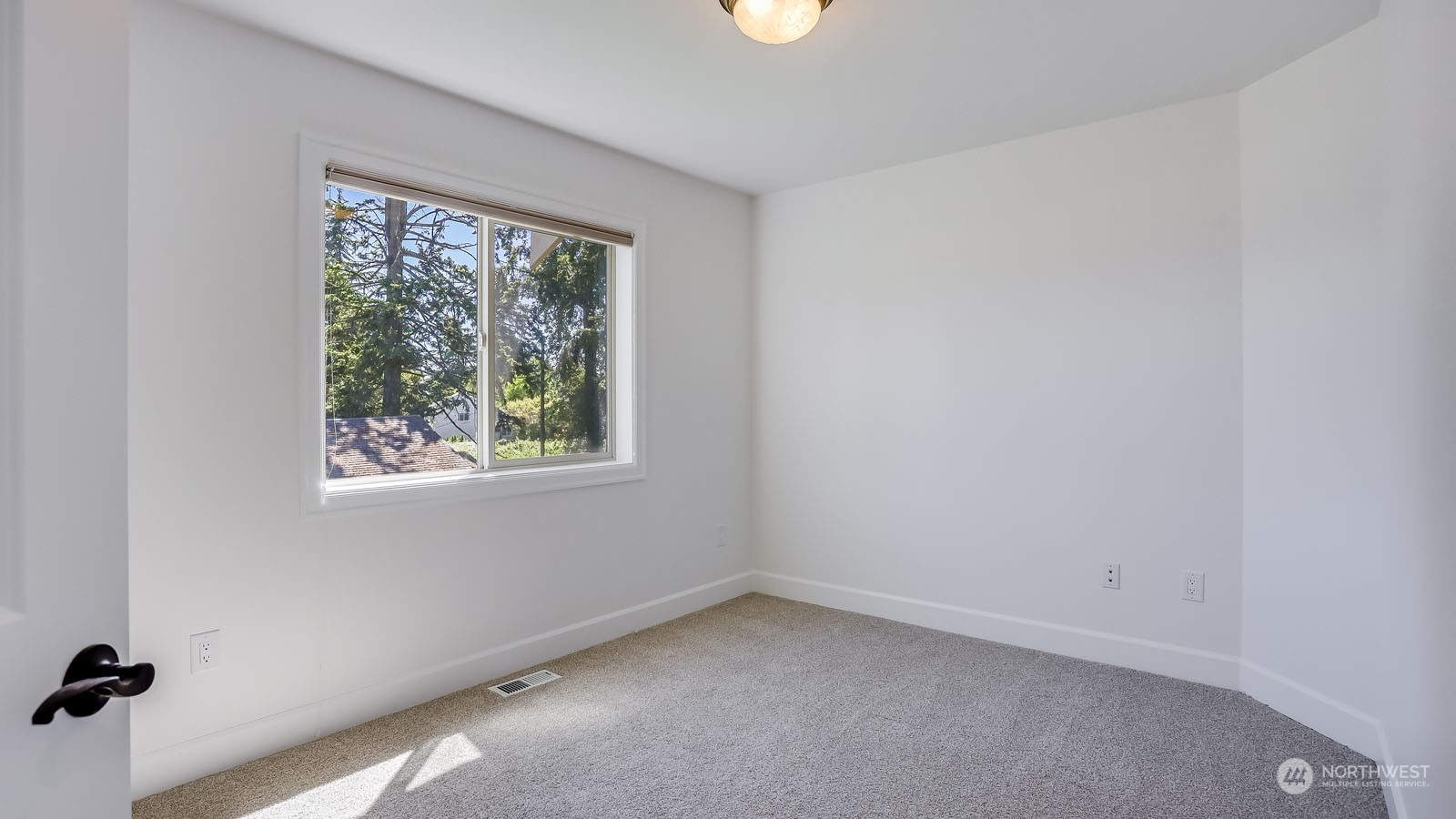 1152 Queen Avenue Northeast Renton, WA 98056 - Photo 34 of 40 an empty room with a window
