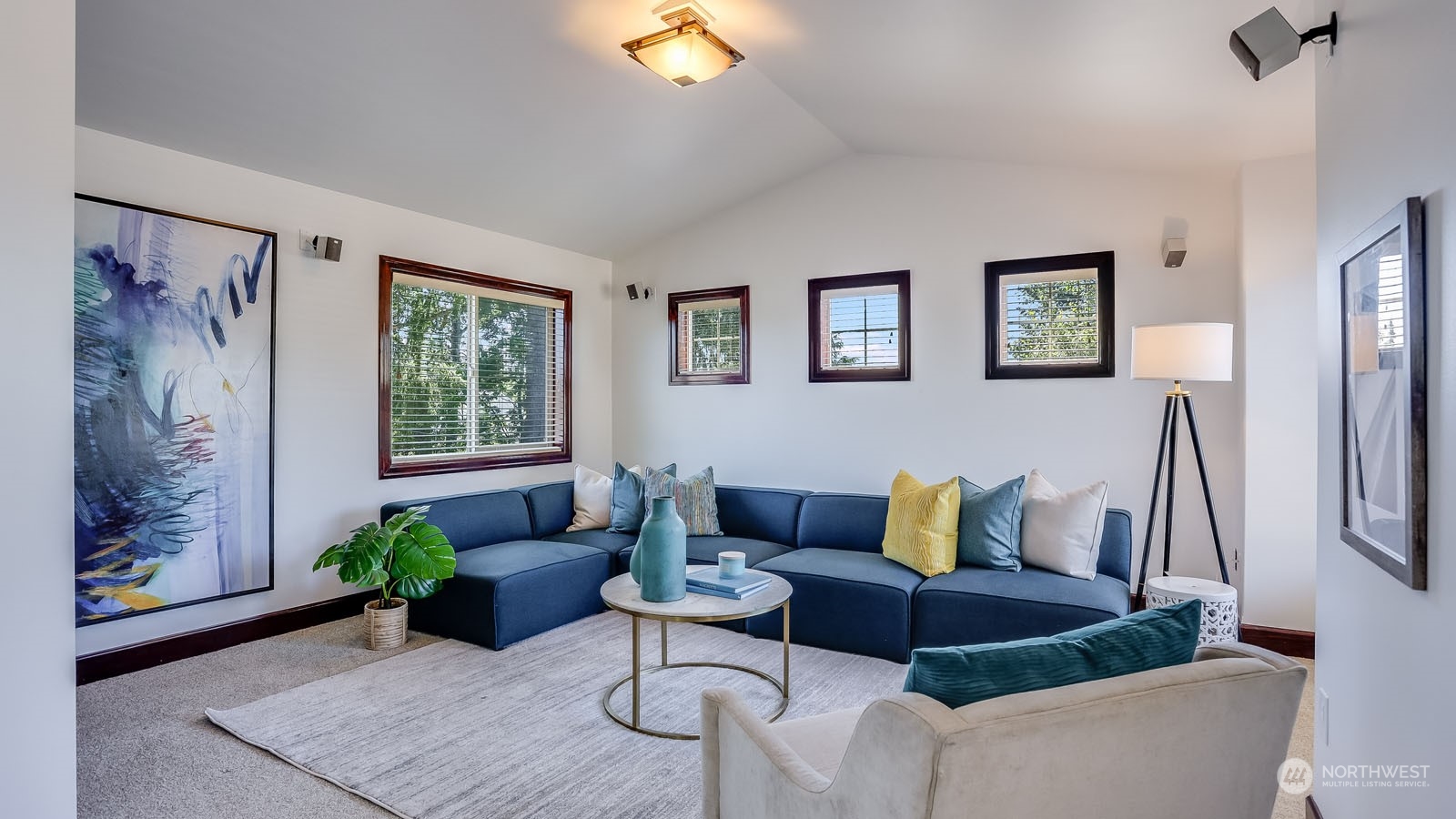 1152 Queen Avenue Northeast Renton, WA 98056 - Photo 36 of 40 a living room with furniture and a potted plant