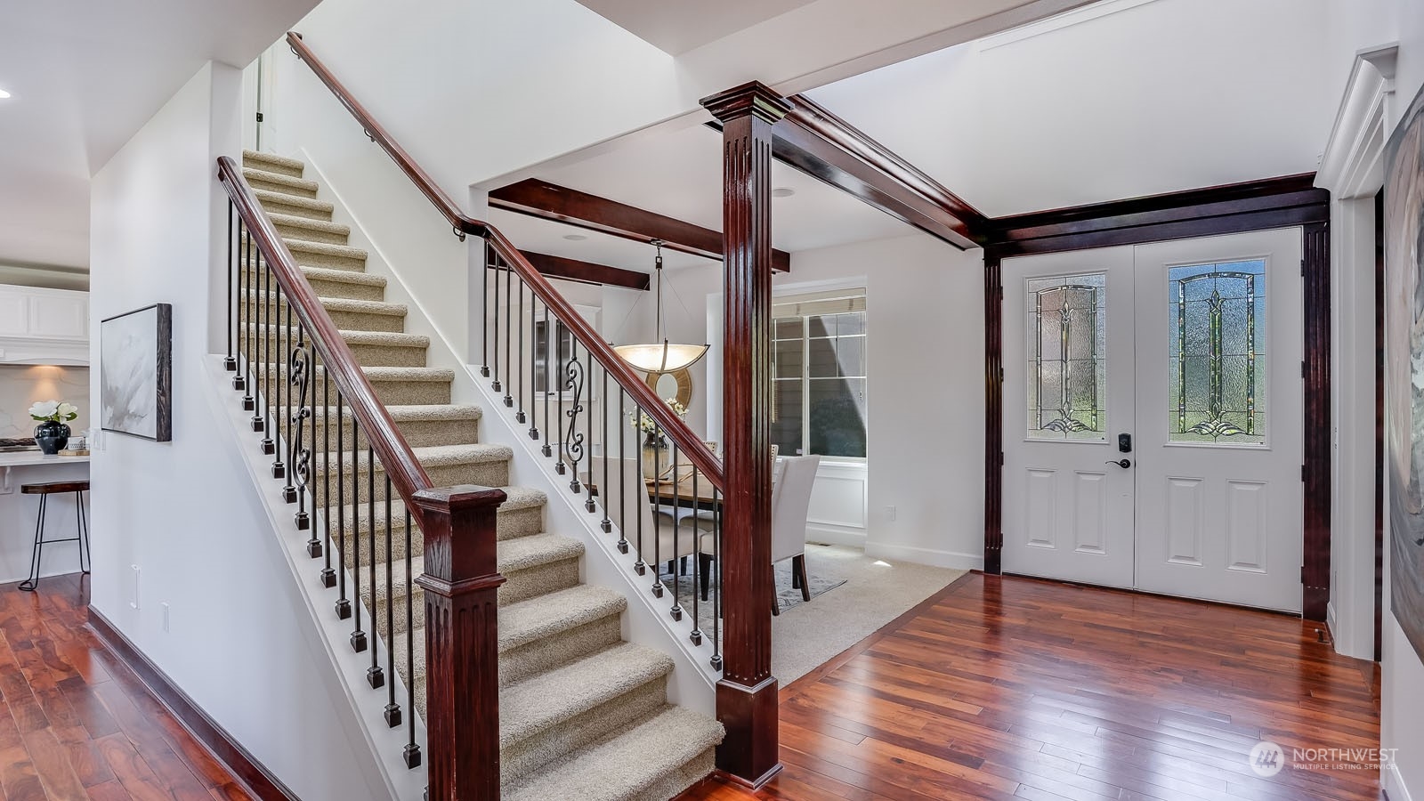 1152 Queen Avenue Northeast Renton, WA 98056 - Photo 6 of 40 a view of an entryway with wooden floor and stairs