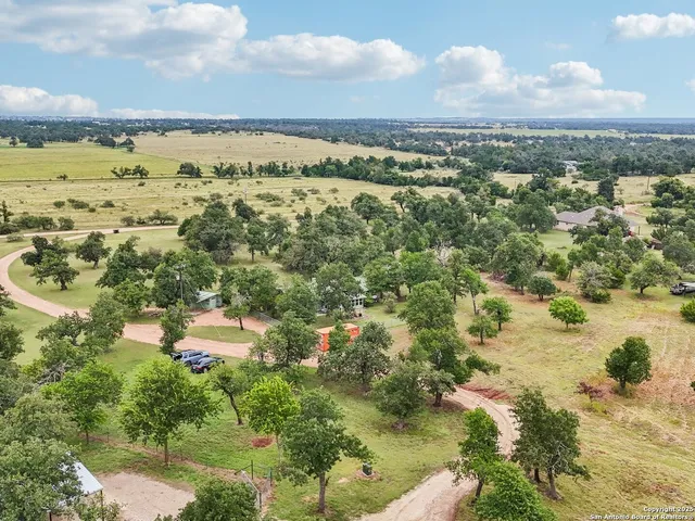 a view of a lake with houses in the back