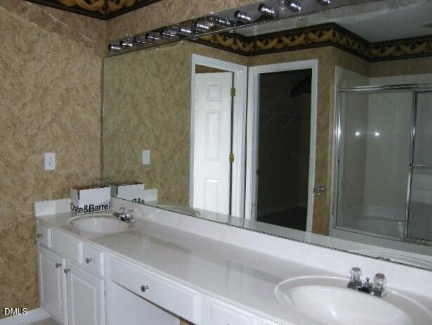 102 Willingham Road Morrisville, NC 27560 - Photo 11 of 19 a bathroom with a sink and a mirror