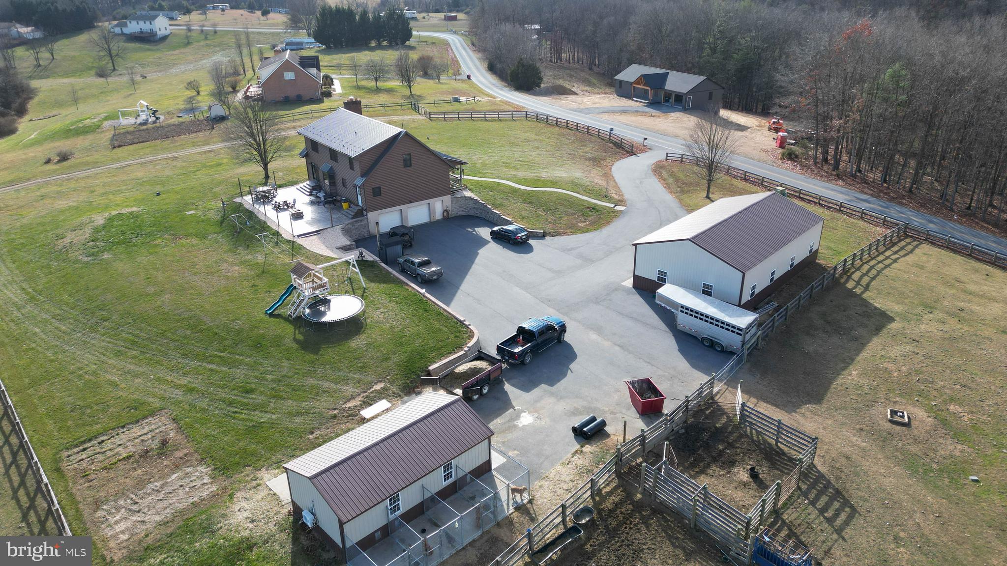 an aerial view of a house with outdoor space