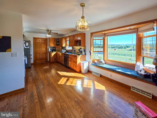 a view of a living room with floor to ceiling window