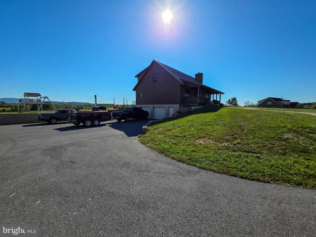 a aerial view of a house with a yard