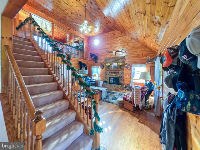 a view of an entryway with wooden floor