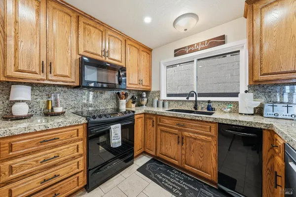 a bedroom with a bed furniture and a flat screen tv