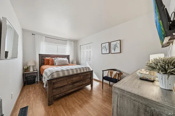 a swimming pool with outdoor seating and lake view