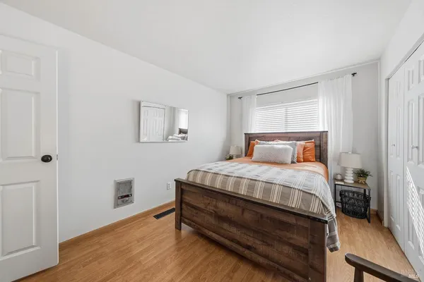 a view of house with yard and lake view