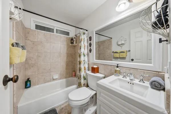 a view of a balcony with two chairs