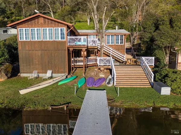 a view of a patio with table and chairs with wooden floor