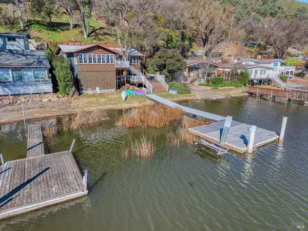 a view of a chairs and table on the wooden floor