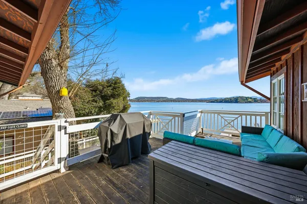 a view of a house with a window and wooden fence