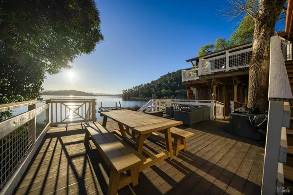 a view of a lake with boats and trees in the background