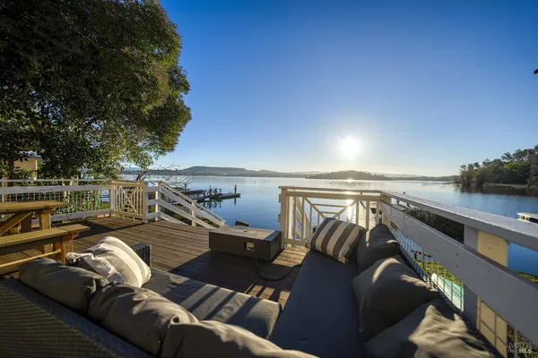 an aerial view of a houses with a lake view