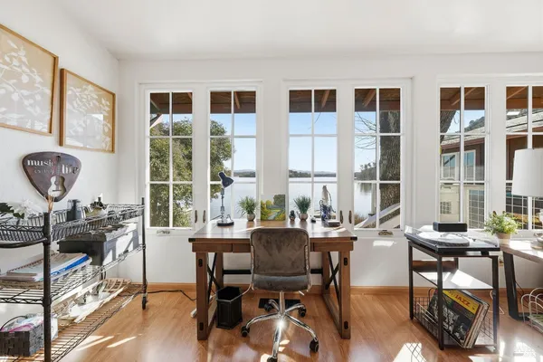 a living room with furniture and a wooden floor