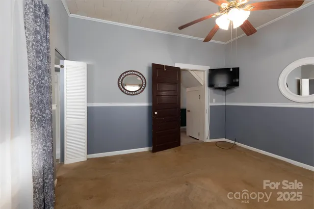 a big room with closet and windows