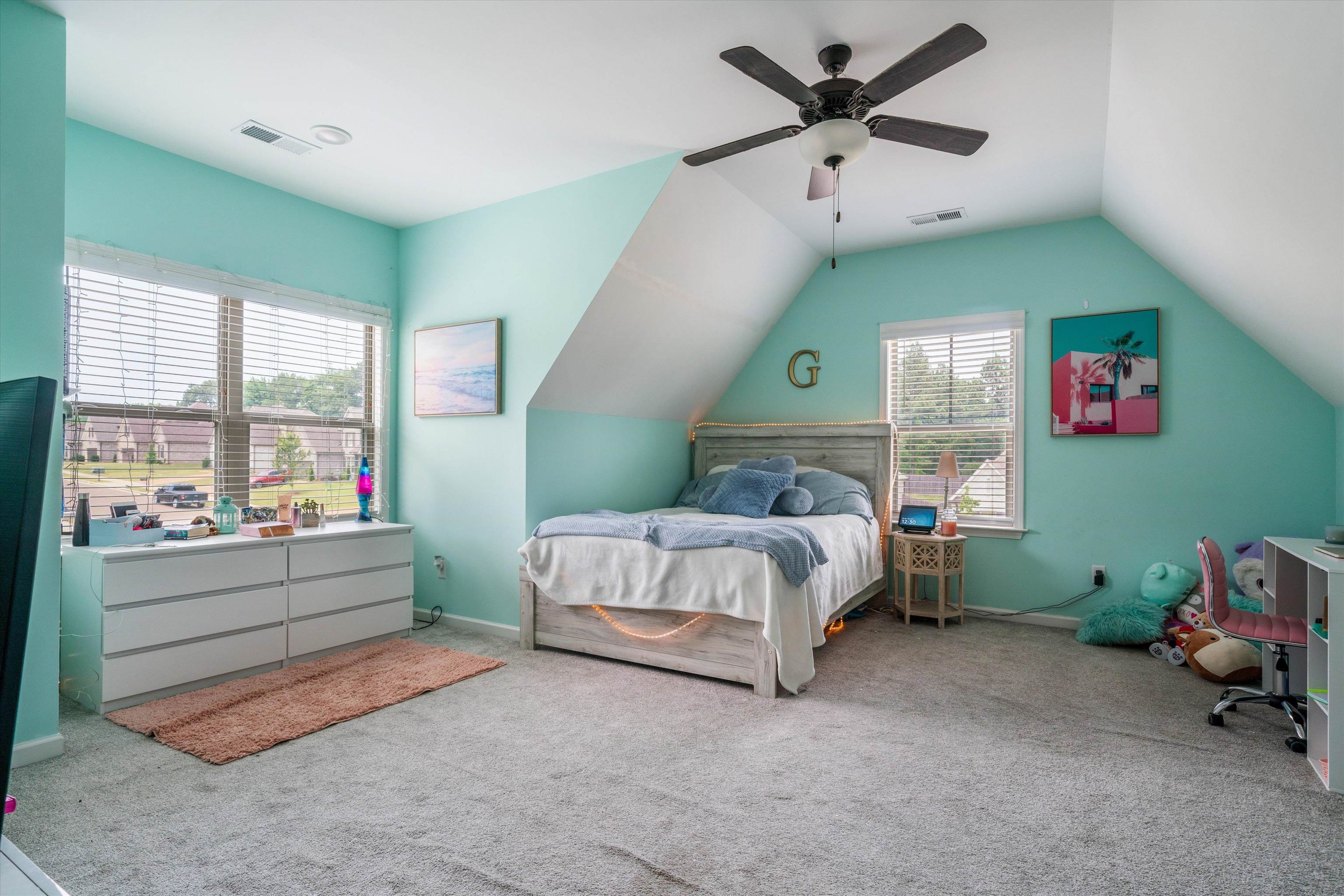 7689 Elpine Gray Drive Bartlett, TN 38002 - Photo 13 of 14 a spacious bedroom with a bed and a chandelier