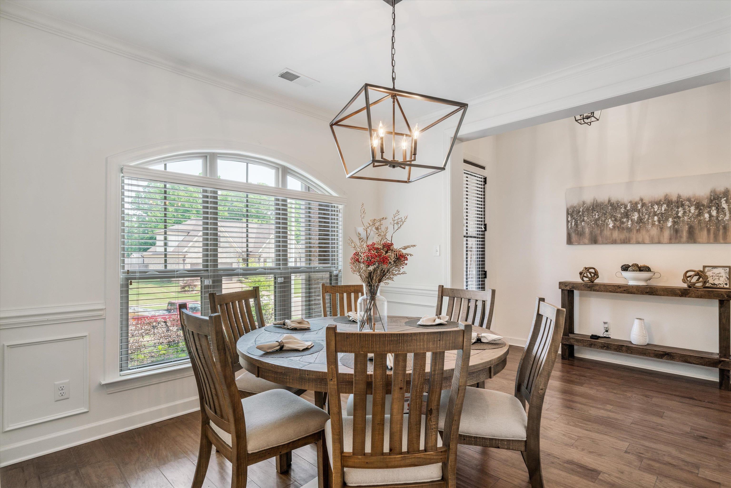 7689 Elpine Gray Drive Bartlett, TN 38002 - Photo 3 of 14 a view of a dining room with furniture window and wooden floor