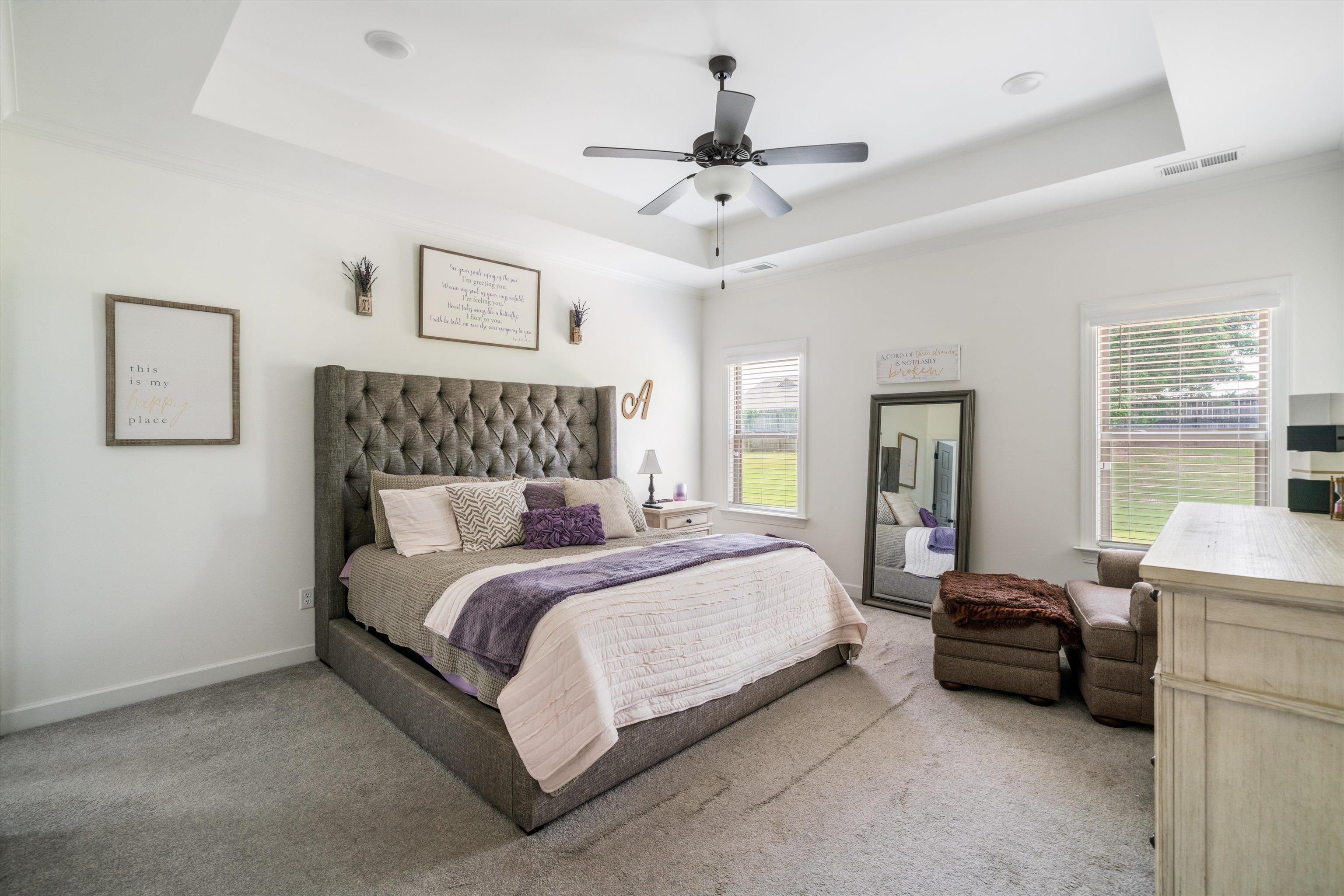 7689 Elpine Gray Drive Bartlett, TN 38002 - Photo 8 of 14 a bedroom with a bed and a chandelier