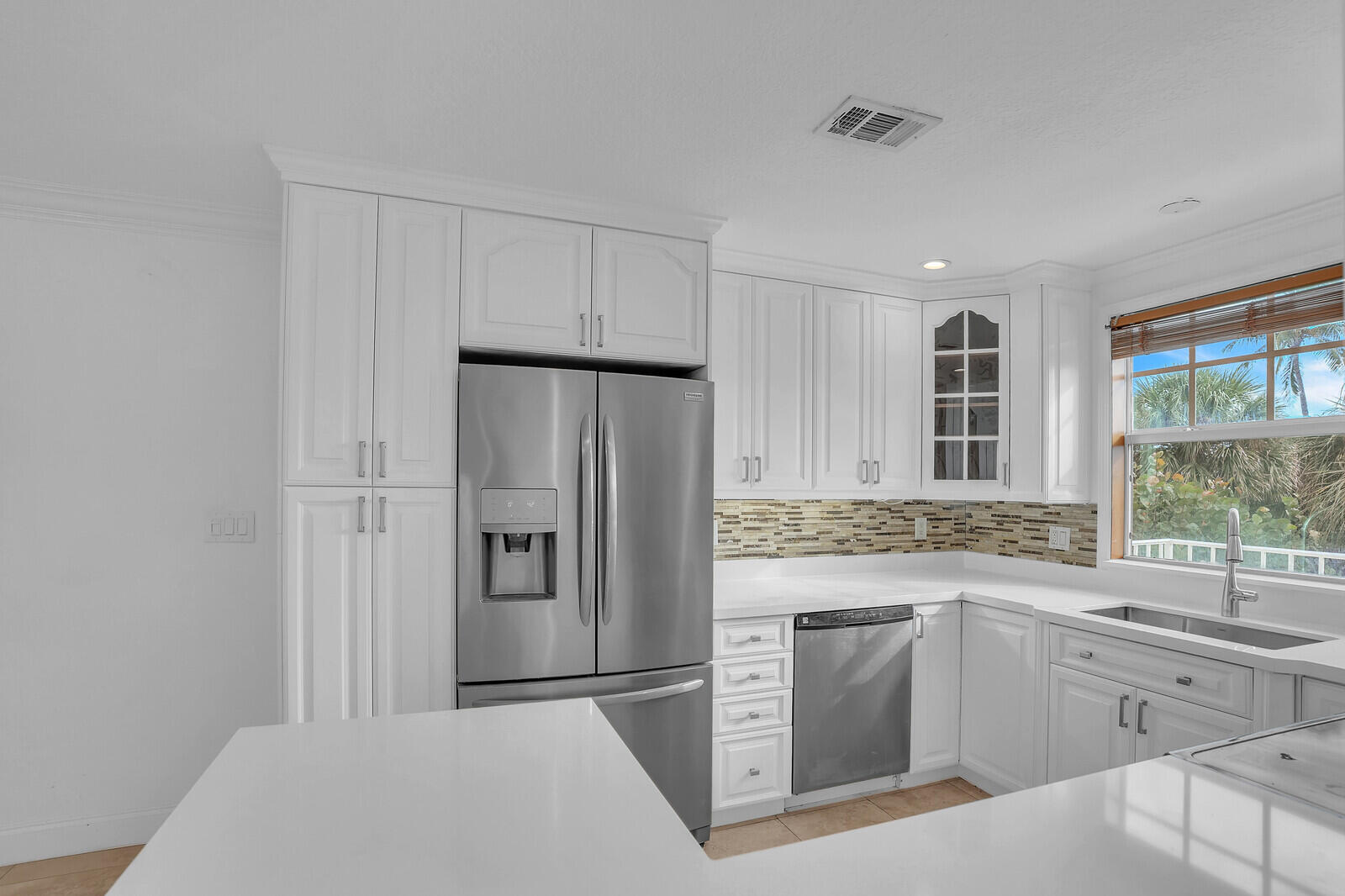 705 Mainsail Circle Jupiter, FL 33477 - Photo 12 of 51 a kitchen with a sink stove and refrigerator