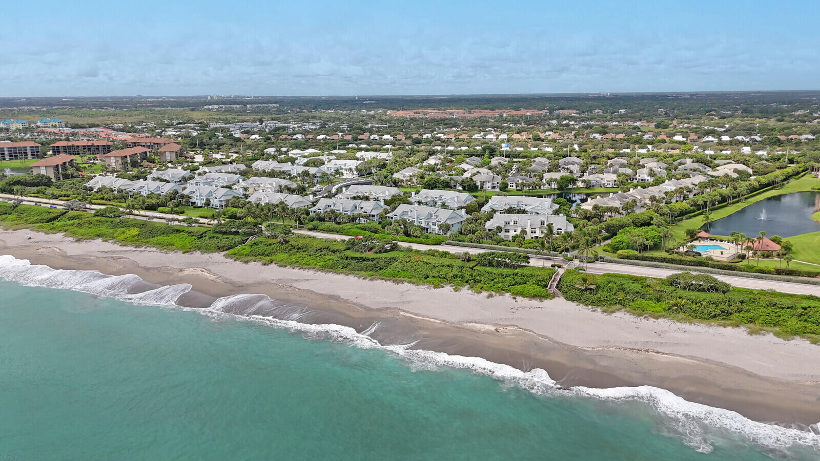 705 Mainsail Circle Jupiter, FL 33477 - Photo 45 of 51 an aerial view of residential houses with outdoor space and trees