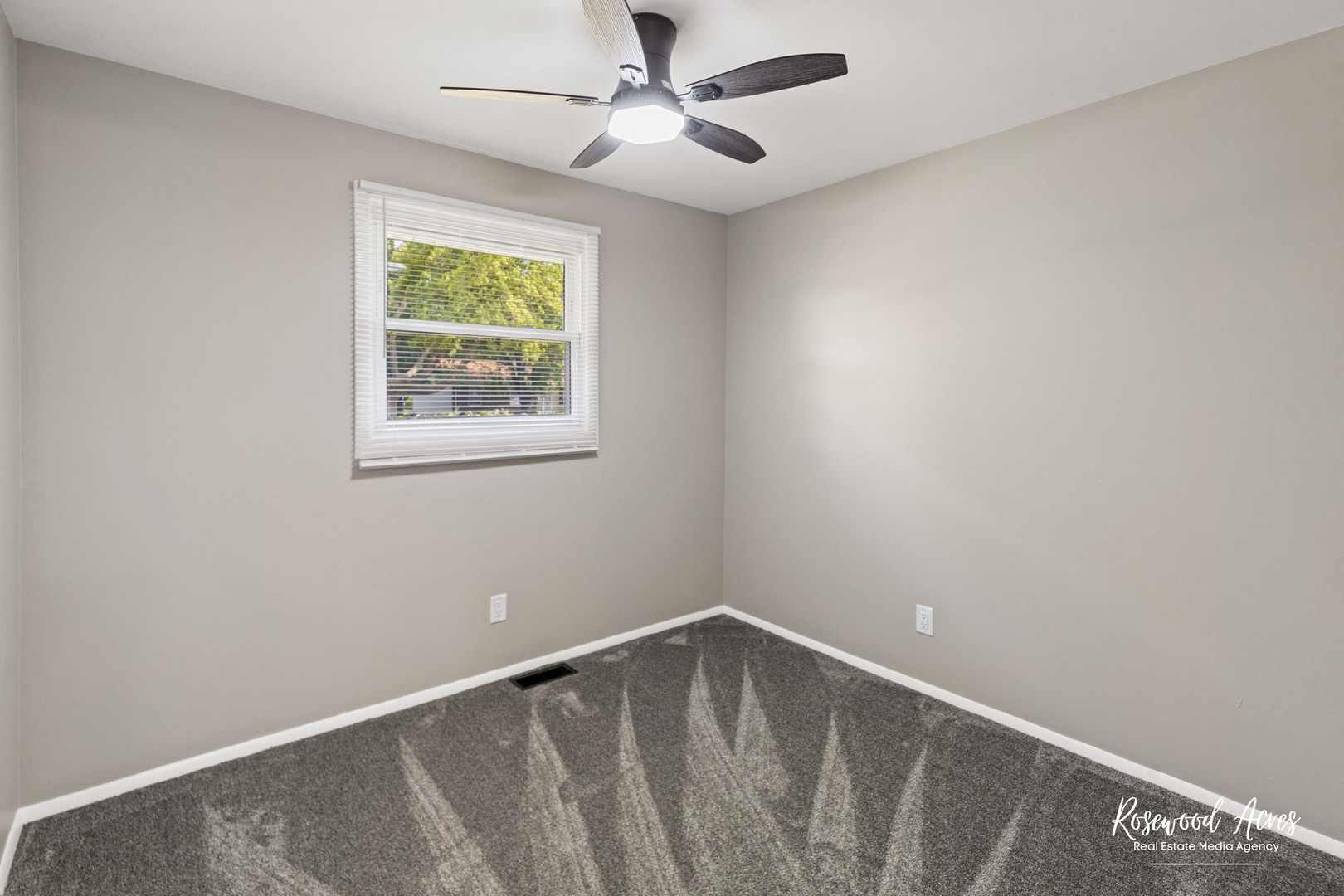 502 East 3rd Street Herscher, IL 60941 - Photo 11 of 15 an empty room with windows and fan