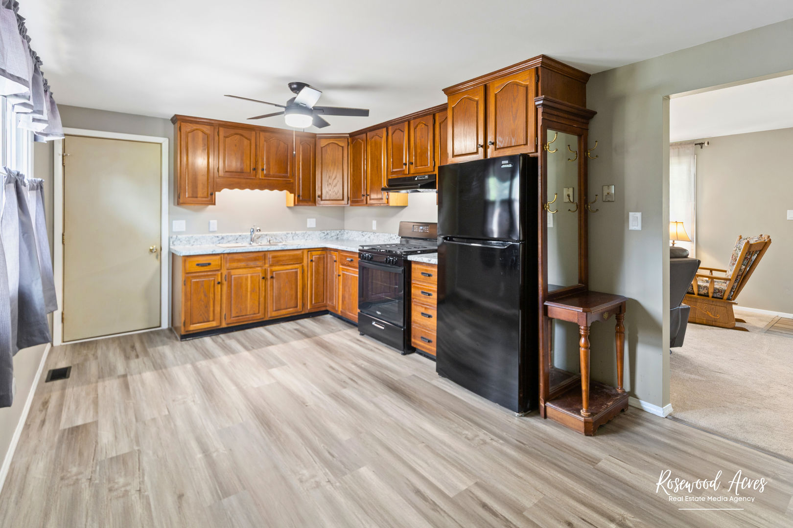 502 East 3rd Street Herscher, IL 60941 - Photo 4 of 15 a kitchen with stainless steel appliances granite countertop a refrigerator a stove and a sink with wooden floor