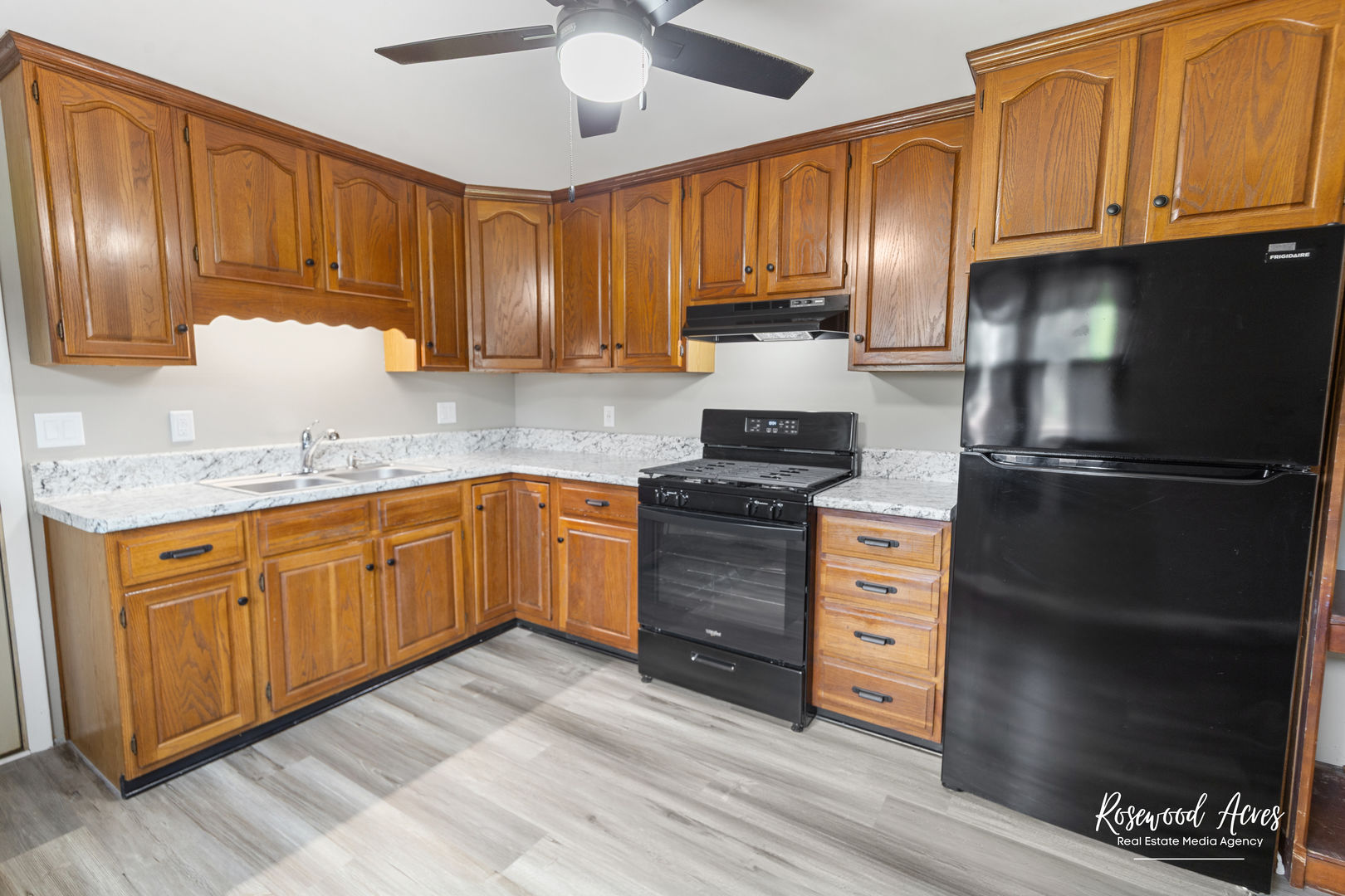 502 East 3rd Street Herscher, IL 60941 - Photo 5 of 15 a kitchen with granite countertop stainless steel appliances and wooden cabinets
